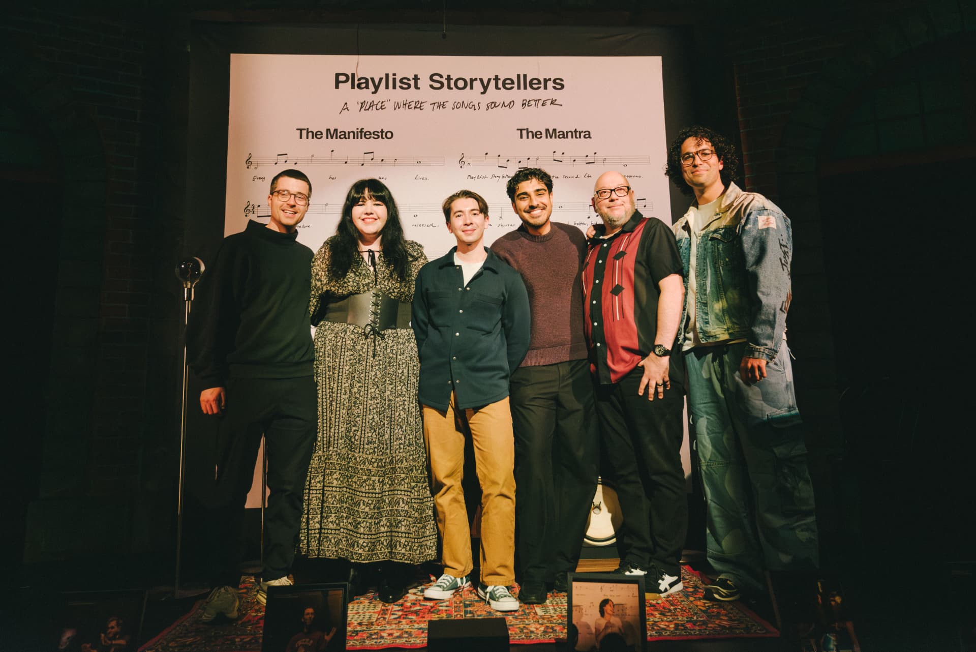 The PLST team in front of the show manifesto